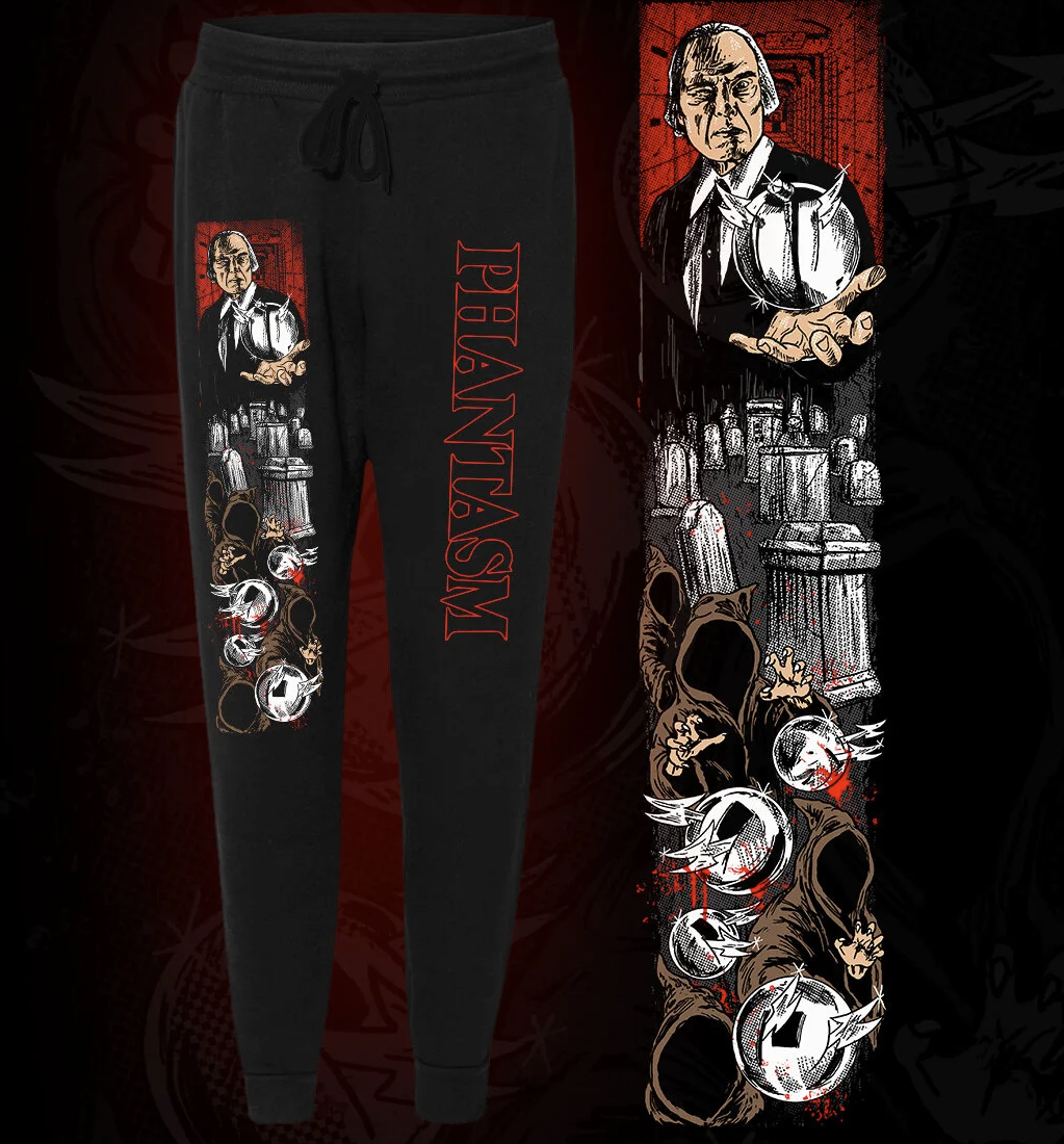Black sweatpants with 'PHANTASM' and "THE TALL MAN" graphic design on a dark background